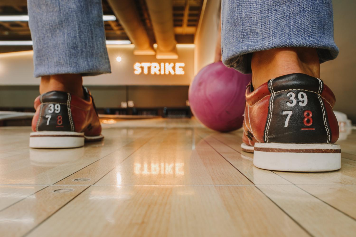 bowling shoes with ball and strike