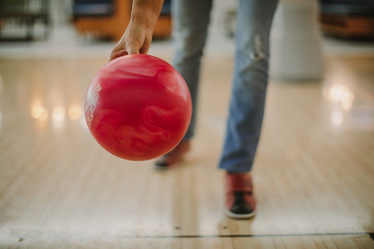 holding a bowling ball