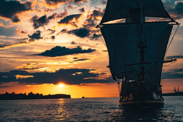 ship sailing into the sunset